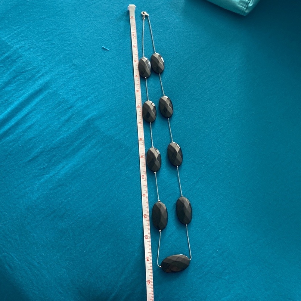 Silver Bracelet w/ black stone-like charms